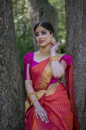 Woman in a traditional silk saree with gold jewellery